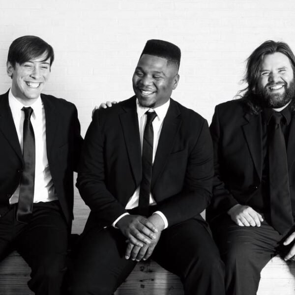 Reggie Sullivan Band, Three men sitting in black and white with suits.