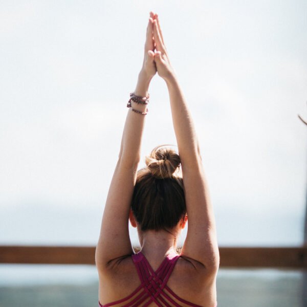 Mile High Yoga at Beech Mountain Resort - Yoga practitioner in a serene mountain setting, surrounded by nature and tranquility at 5,506 feet elevation.