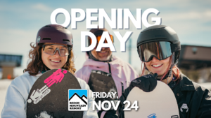 Opening Day at Beech Mountain resort. 3 snowboarders holding their boards and smiling.